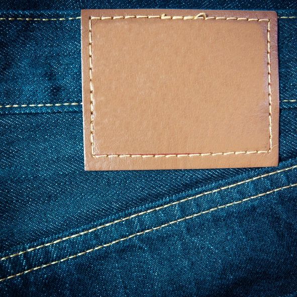 Garment label detail representing Big J-Hook Tag Pin applications
