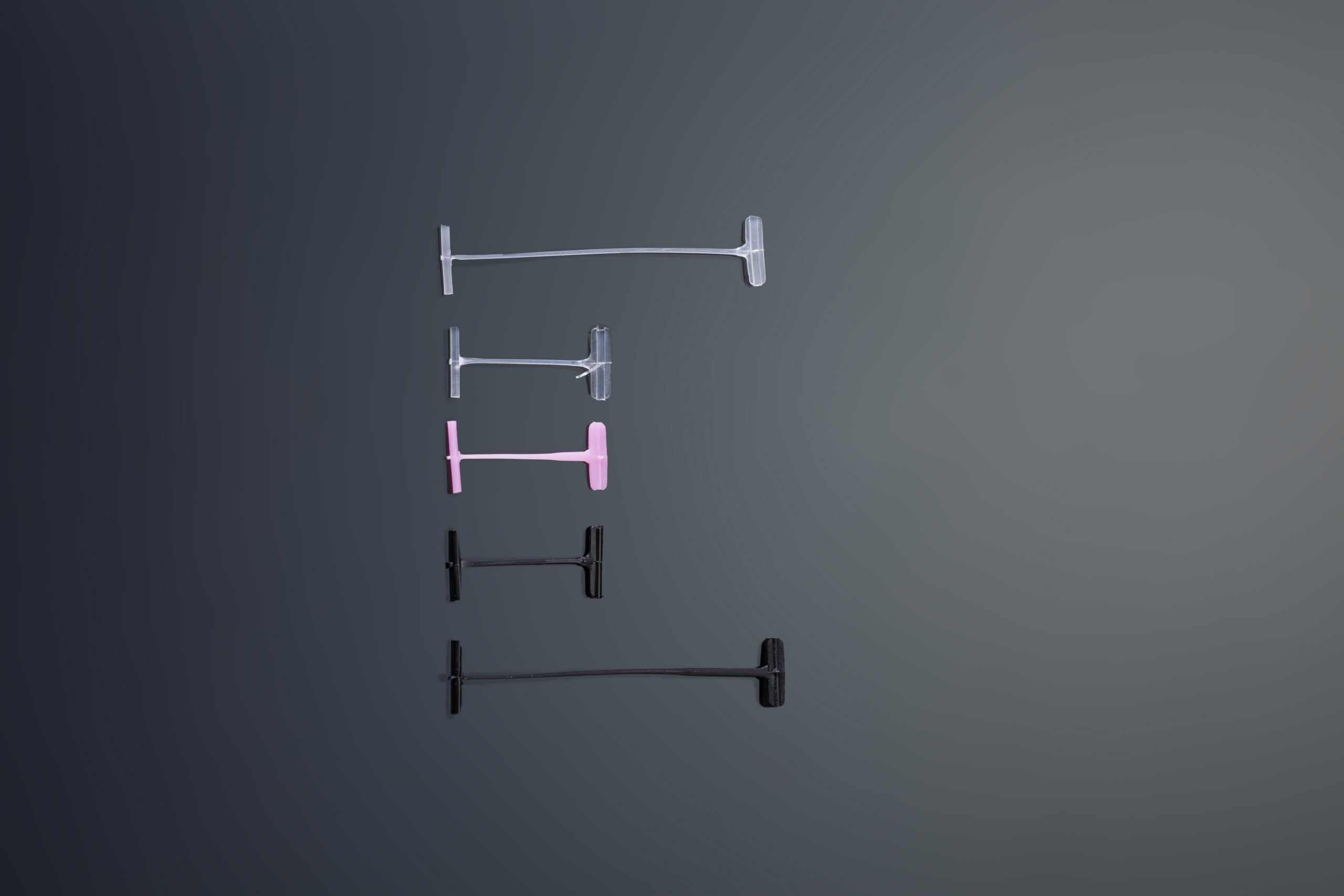 Small Pedal Tag Pins in clear, pink, and black